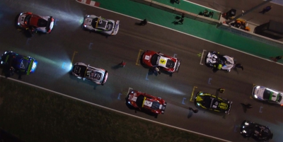Topshot of a car race by night